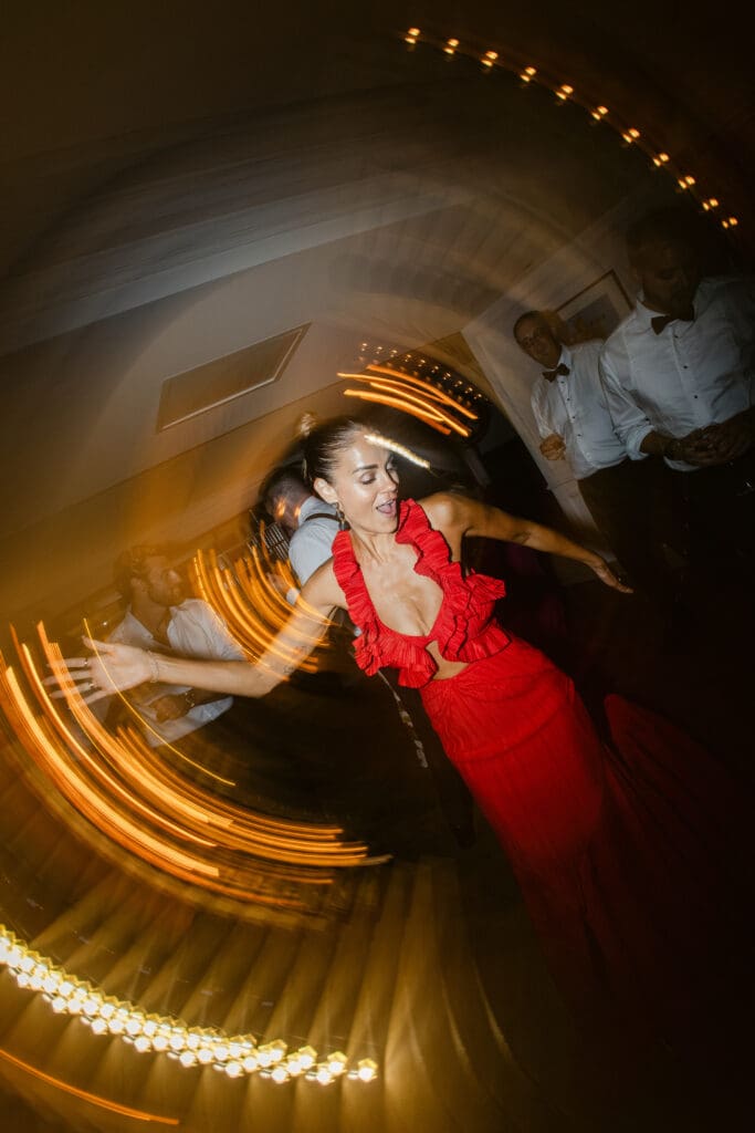 Guest dancing during luxury wedding after-party at Airelles Saint-Tropez with editorial style.