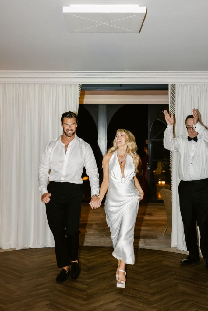 Bride and groom making their grand entrance to the after-party at Airelles Saint-Tropez.