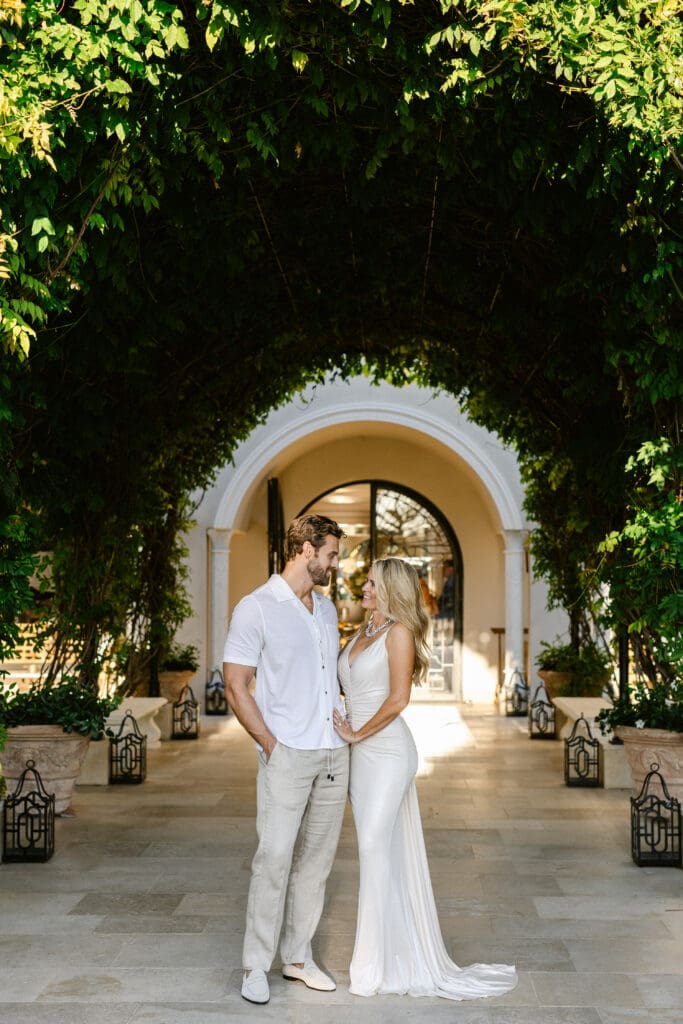 Modern couple posing under the archway at Airelles Saint-Tropez during destination wedding.