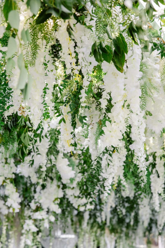 Elegant floral ceiling installation for luxury wedding reception in France.