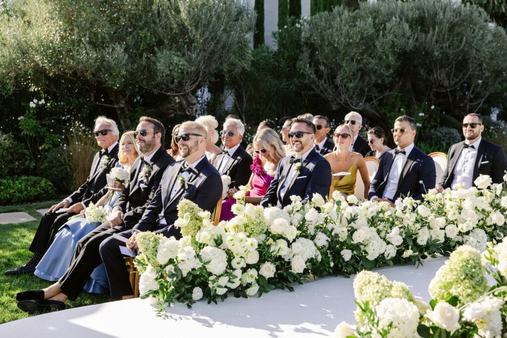 Guests seated for a luxury French Riviera wedding ceremony with scenic garden views.