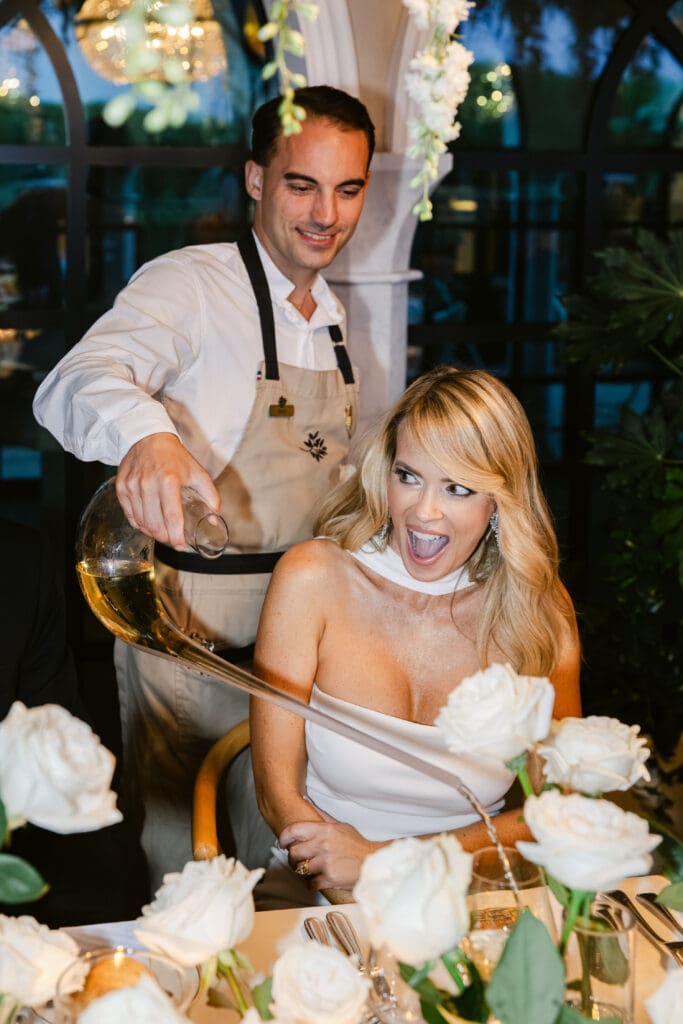 Fine dining experience with elegant wine service during luxurious wedding dinner at Airelles.