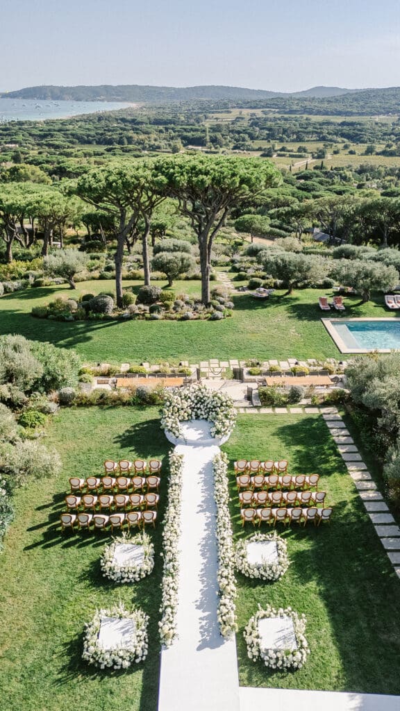 Elegant outdoor wedding ceremony at Airelles Saint-Tropez overlooking the Mediterranean Sea.