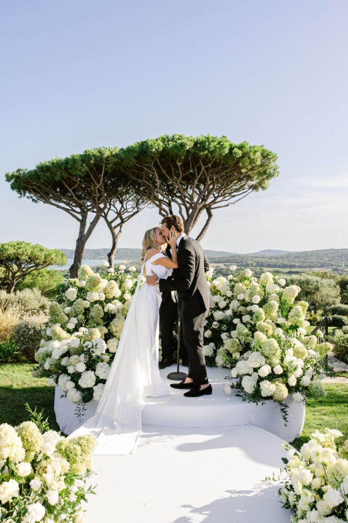 First kiss as newlyweds during elegant wedding ceremony in Saint-Tropez at Airelles.