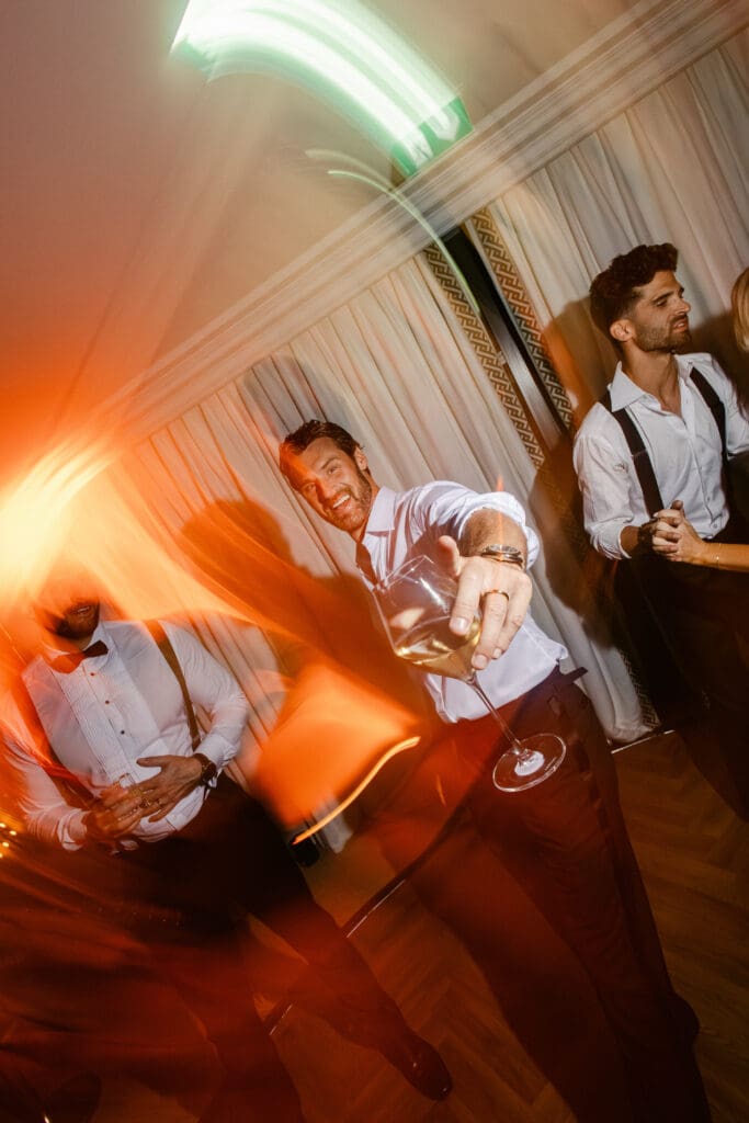 Groom enjoying wedding party at Airelles Saint-Tropez during luxury celebration.