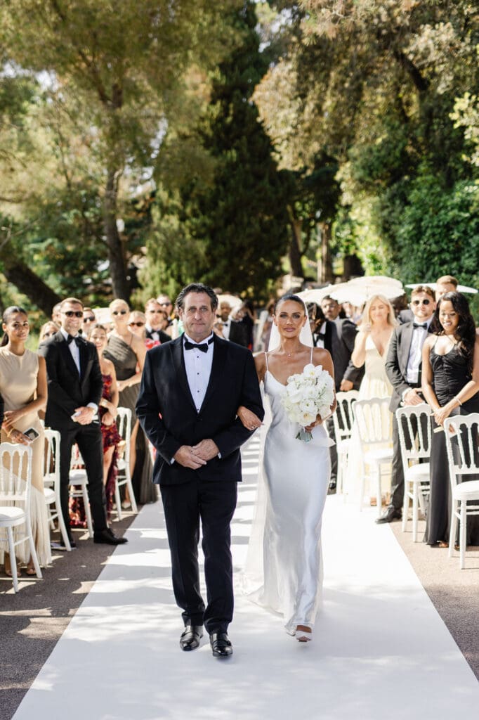 Bride walking down the aisle at Domaine du Mont Leuze wedding ceremony French Riviera — Marion Pinel