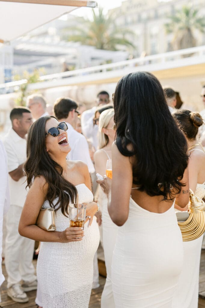 Guests in white at welcome dinner Boccamar Nice before Mont Leuze wedding French Riviera — Marion Pinel
