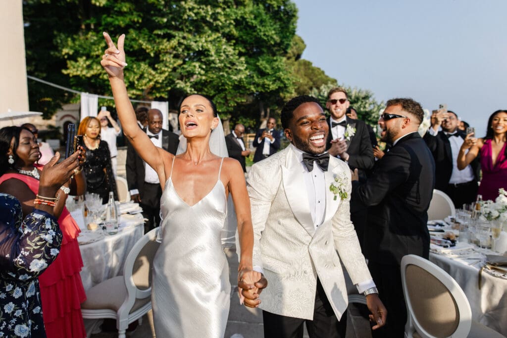 Bride and groom grand entrance to wedding reception at Domaine du Mont Leuze French Riviera — Marion Pinel